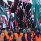 Members of a neo-fascist rally in Warsaw, Poland in 2018 waving the flags of Poland’s National Radical Camp and Italy’s Forza Nuova.